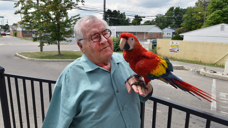 Joe Mumpower and his Scarlet Macaw are frequent entertainers at Starbucks.