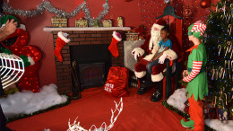 A young child visits with Santa at last years event. File photo.