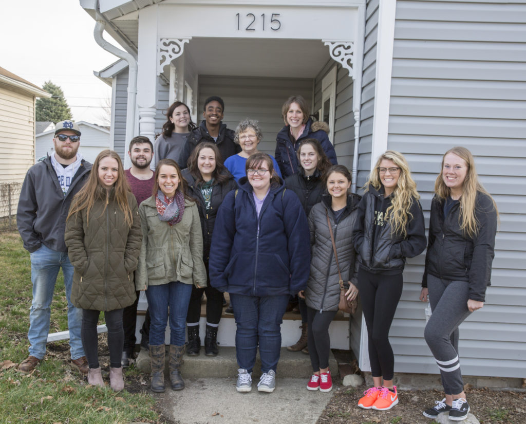 Ball State Journalism Instructor Kate Elliott is guiding a team of marketing, public relations, and advertising students to help ecoREHAB tell its compelling story. The students met with ecoREHAB’s latest homeowner, Norma Ruttan, at her home on 10th Street. Photo provided.