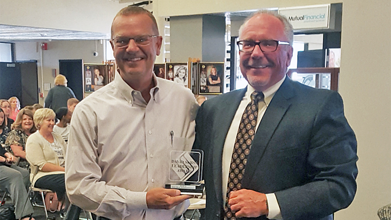 Pictured (L-R): Pat Botts is presented the 2017 David Sursa Leadership Award by Jeffrey R. Lang, Chairman of the Board of The Community Foundation. Photo provided.