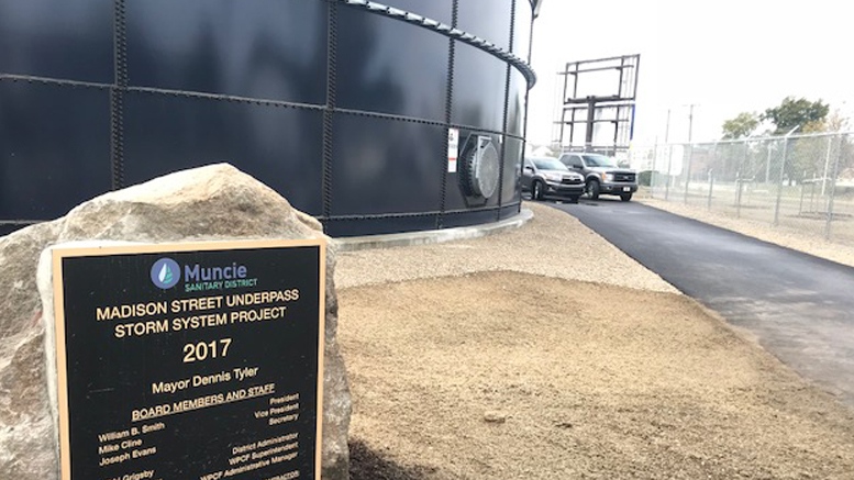 Madison Street Underpass Storm Sewer System plaque and 750,000-gallon steel storage tank. Photo by: Bowen Engineering.