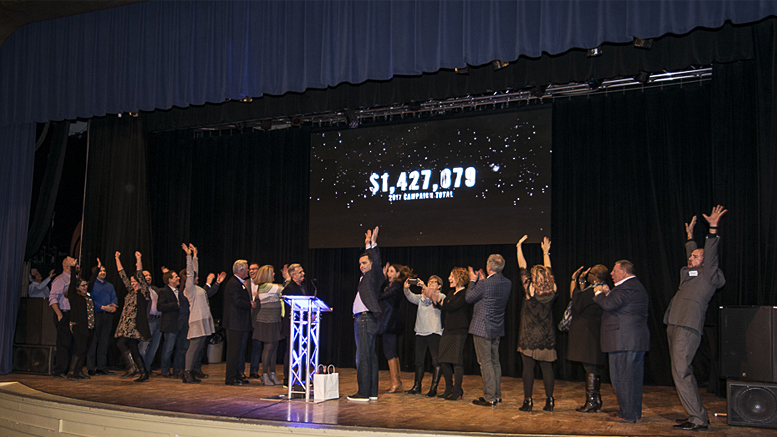 Results of the 2017 United Way Campaign are unveiled as members of the campaign team take the stage at Cornerstone. Photo by: Mike Rhodes