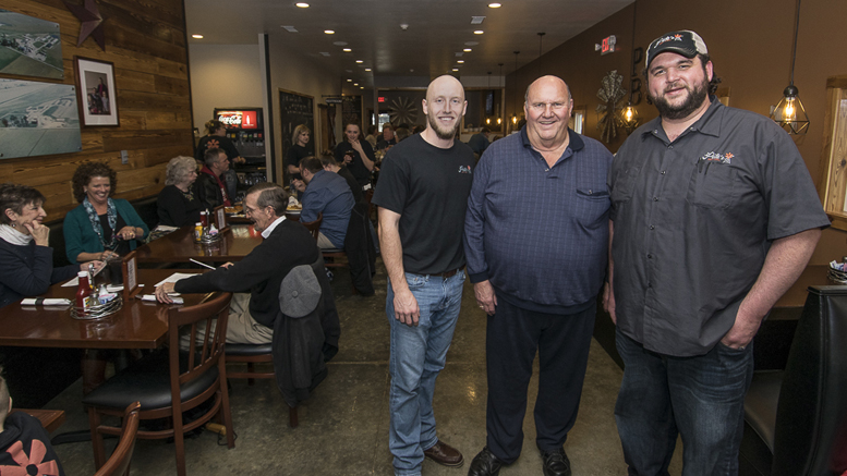 (L-R) Josh Shaffer, Phil Peterson and Caleb Churchill are pictured during the soft opening on March 29th. Photo by: Mike Rhodes