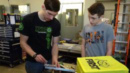 PhyXTGears team members work on parts for the team's robot during build season. Photo provided.