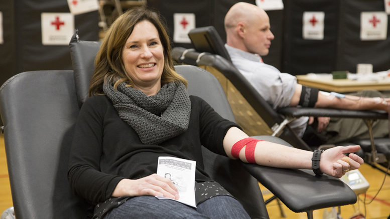 Heidi Reed sits in a donor chair following her blood donation. The day of Heidi's donation, her mother received blood during a surgery. Photo by Amanda Romney/American Red Cross