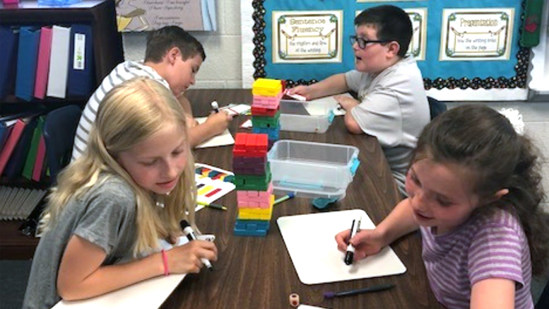 Fourth grade students reinforce math and science skills through a building block game as part of a 2017-2018 Robert P. Bell Education Grant. Photo provided.