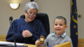 The Honorable Marianne L. Vorhees is pictured with a young child adopted on National Adoption Day. Photo by: Elizabeth Saylor