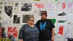 Amy and Andy Shears are pictured in front of some of the custom maps available at the Muncie Map Company. Photo provided