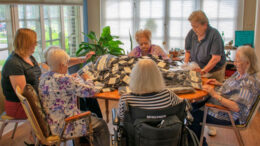 Alpha Center, Inc. provides adult day services for the elderly. The Community Foundation awarded Alpha Center a $15,000 grant to support operations and programming, like this quilting activity for clients. Photo provided