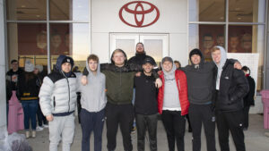A group of volunteers poses for a photo at the Secret Families event at Toyota of Muncie. (Note the fellow in the back who "jumped up" for the photo bomb opportunity. His feet aren't on the ground. I watched his perfectly timed, perfectly centered jump.) Photo by: Mike Rhodes