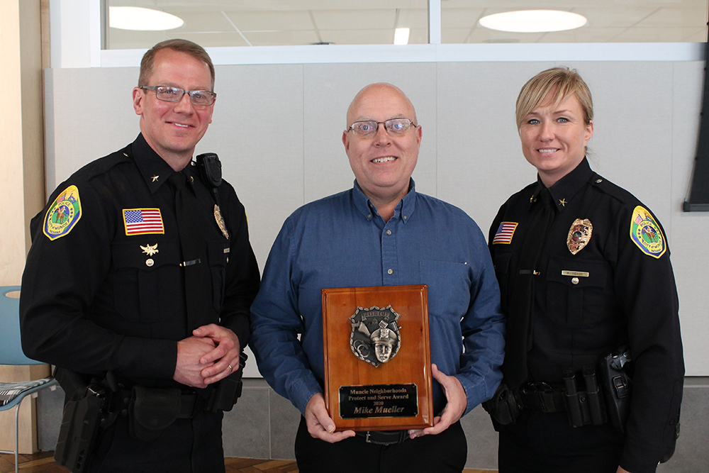 L-R: Chief of Police, Nathan Sloan, Mike Mueller, and Deputy Chief of Police, Melissa Pease.