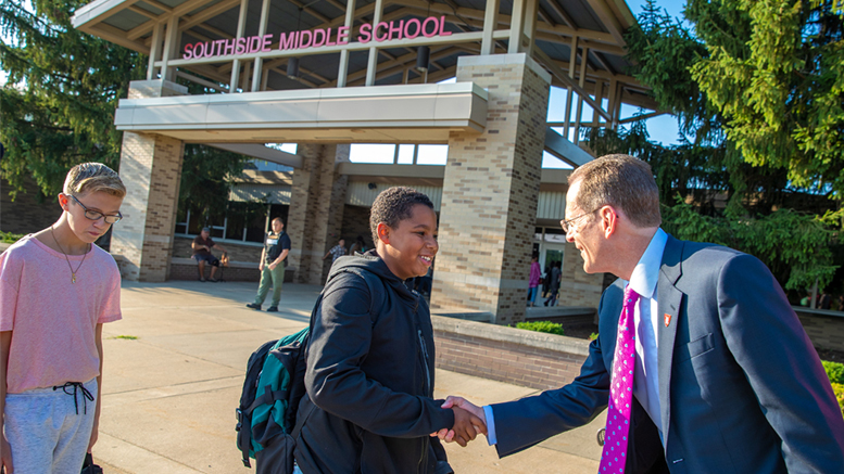 Ball State University President Geoffrey S. Mearns greets students as they attend class at Southside Middle School. Photo provided