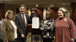 Muncie Mayor Dan Ridenour presents proclamations to MPL administrators. Left to right: Retiring MPL Assistant Director Beth Kroehler, Mayor Dan Ridenour, MPL Library Director Akilah Nosakhere, and Incoming MPL Assistant Director Katherine Mitchell. Photo by Susan Fisher