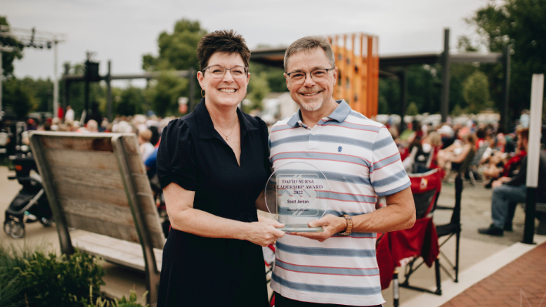 Foundation president Kelly K. Shrock presents the 2022 David Sursa Leadership Award to Scott Jordan for his service to Orchestra Indiana during the Patriotic Pops Concert on July 4th at the Yorktown Civic Green.