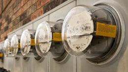 A bank of electric meters at an apartment complex. Photo by storyblocks