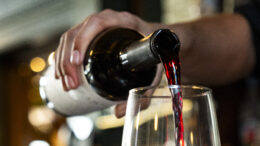 A Vera Mae's bartender pours a glass of Pinot Noir for a guest. Photo provided.