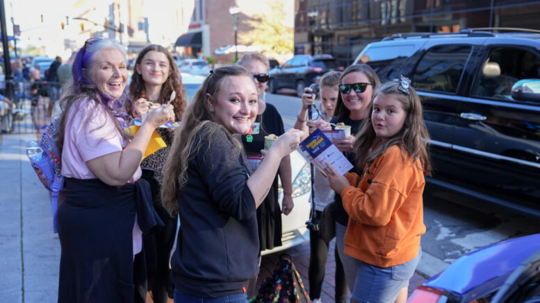 A group enjoys soup from a previous soup crawl in downtown Muncie. Photo provided.
