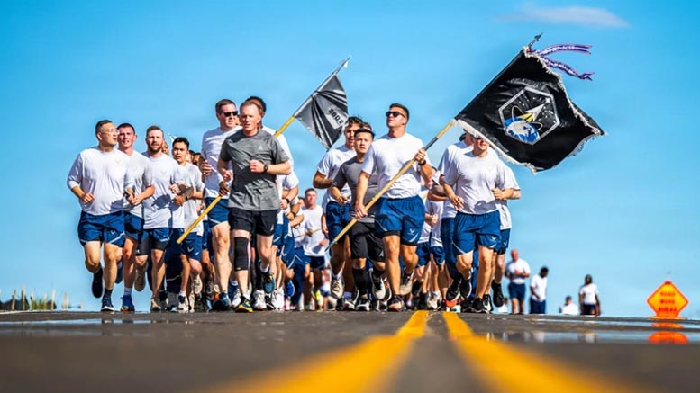U.S. Service members run together during a base wide run at Buckley Space Force Base, Colorado, Oct. 9, 2025. The event showcased the importance of personal fitness and teamwork in maintaining a combat ready force. U.S. Space Force photo by Tech. Sgt. Jordan Thompson.