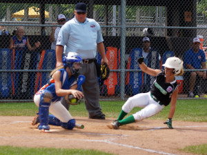 Delaney Boyd slides safely into home, scoring an early run in Team Indiana’s quick start against Team Michigan.