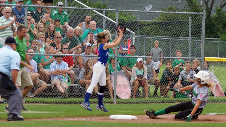 Yorktown’s Lexie Robertson safely stretches her hit into a triple.