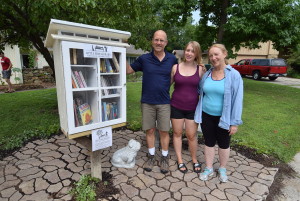 Craig, Anna and Elianor beside their new neighborhood "little free library."
