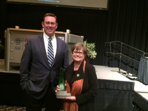 Jud Fisher is pictured with Juli Metzger and the John W. and Janice B. Fisher Governance Award she received. Photo provided.