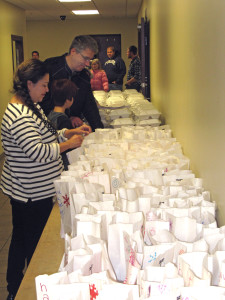 Volunteers preparing food to be delivered to those who are home bound. Photo provided.