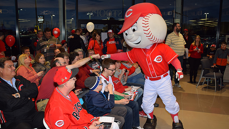 Fist bump at the Reds Caravan held at Stoops Automotive in 2017. Photo by: Mike Rhodes