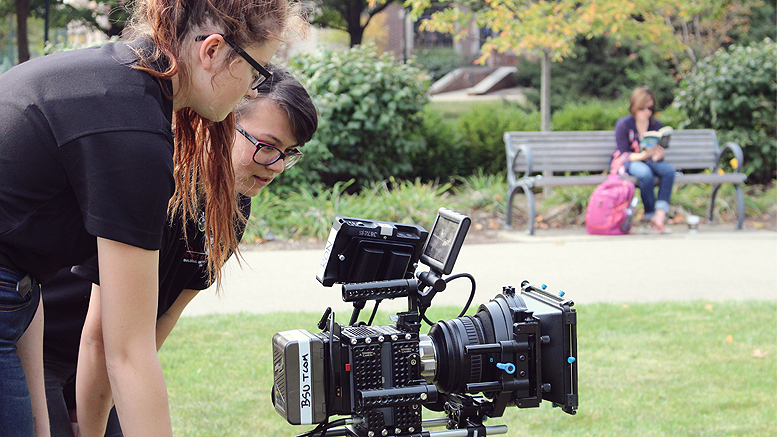 Students monitor a shot during filming of a BSU commercial. Photo by: Sadie Lebo