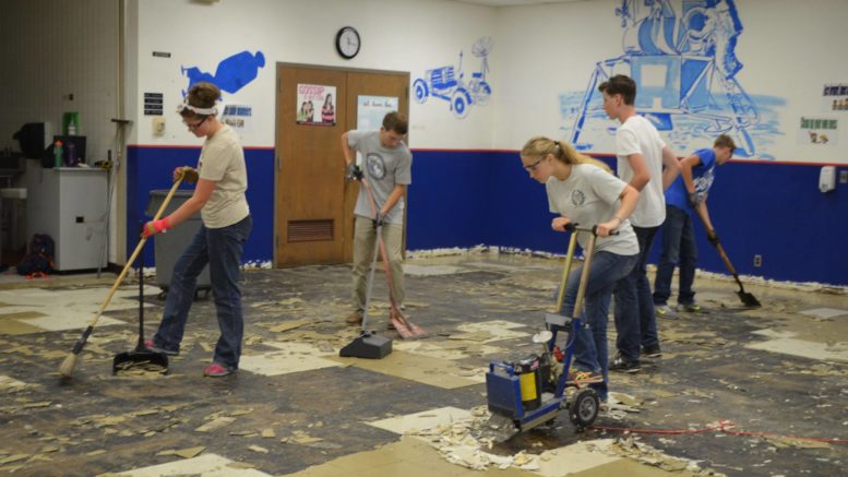 "World Changers" working to replace school flooring. Photo provided.