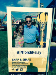 Torch Bearers Delyn Harty-Isom and Mayor Dennis Tyler take a “selfie” at the Torch on Tour booth at the Delaware County Fair. Photo by: Nancy Carlson