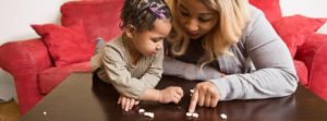 A young mother works with her child. Photo provided.