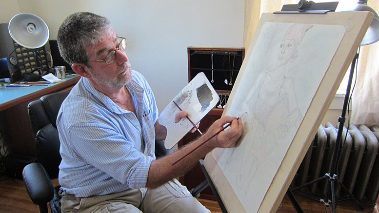 Artist Allan LaBerteaux works on the portrait of a lady named Destry. Photo by: John Carlson
