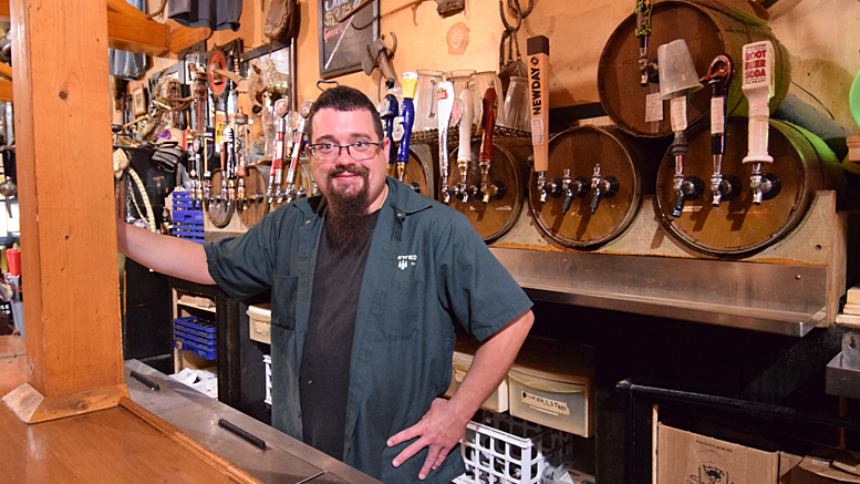 Bartender Mike Favors of the Heorot Pub and Draught House in downtown Muncie is pictured. Photo by: Mike Rhodes