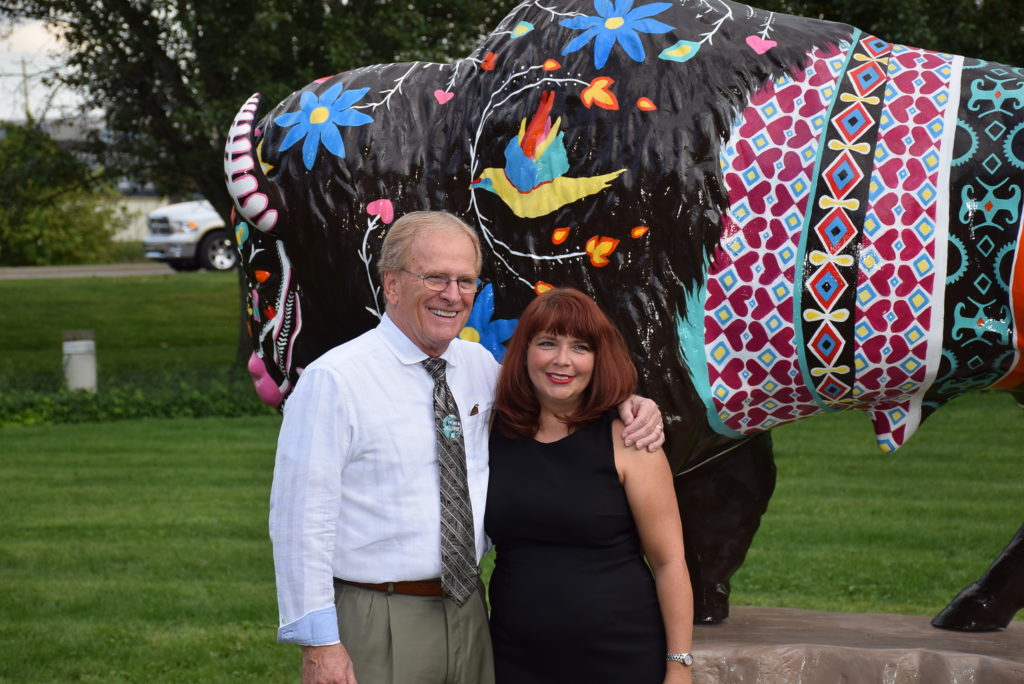 Mayor Dennis Tyler is pictured with Denise King, the artist who designed the Bison, now named "Neolin."