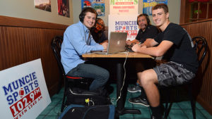 Muncie's Sports Station's Mark Forester and Cliff Johnson are shown as they broadcast live from Mancino's in Muncie, during the High School Football Sectional Preview show. Photo by: Mike Rhodes