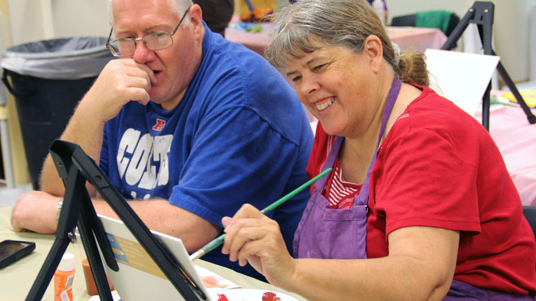 Sheila Satterfield has fun making some good "Bad Art" during a recent Bad Art Night. Photo provided.