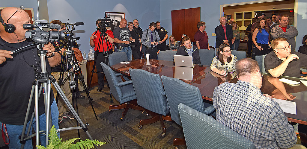 Members of the media, local officials, and members of the City of Muncie Police Department spilled out into the hallway during Friday's afternoon press conference. Photo by: Mike Rhodes