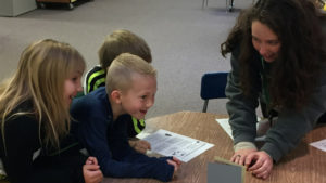 A teacher works with her students in the classroom. Photo provided.