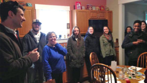 ecoREHAB Executive Director Craig Graybeal introduces Ball State students to Muncie native, Norma Ruttan, who purchased the nonprofit’s latest rehabilitated home. The students—a mix of public relations, marketing, and advertising majors—are helping ecoREHAB increase the impact of its neighborhood revitalization efforts. Photo provided.