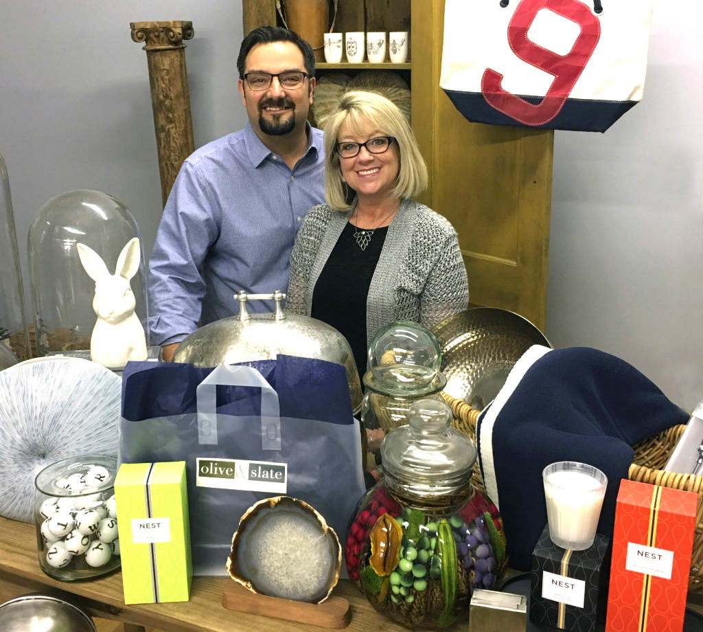 Sean and Heidi Hale are pictured behind some of the elegant and unique products they will be offering at Olive & Slate.
