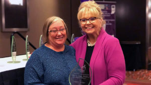 Diana Badger, Executive Director of Apple Tree Child Develeopment Center receives her award. Photo provided.