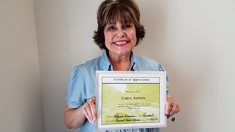 Ammon holding PCA framed appreciation certificate honoring her for enthusiastic support of the ongoing mission of the PCA Council of Delaware County. Photo provided.
