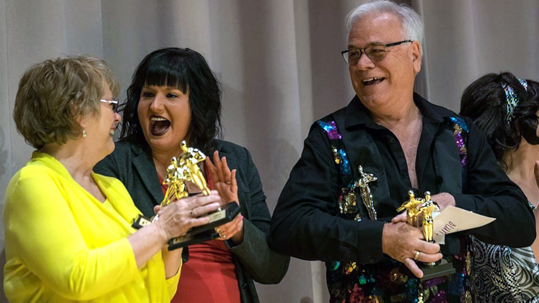 Steve and Vicki Jeffers accept their awards for winning the Audience Choice award, the Judges' Choice award, and the Best Costume Award. Photo credits: Shoot For Good Muncie (shootforgoodmuncie.com).