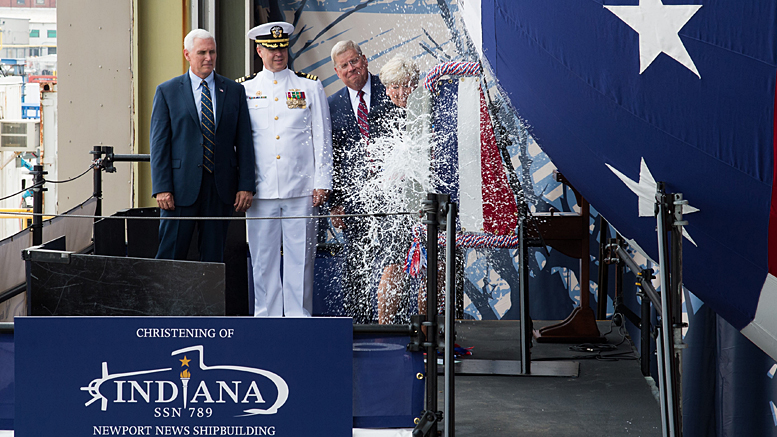 Ship's Sponsor Diane Donald christens the Virginia-class attack submarine Indiana (SSN 789), witnessed by, from left, Vice President Mike Pence, Cmdr. Jesse Zimbauer, Indiana's commanding officer, and Newport News Shipbuilding President Matt Mulherin. (U.S. Navy photo courtesy Huntington Ingalls Industries by Ashley Major/Released)