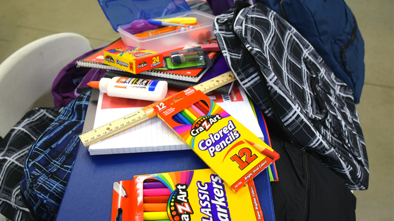 Some of the school supplies parents and children will find stuffed inside their free backpacks. Photo by: Mike Rhodes