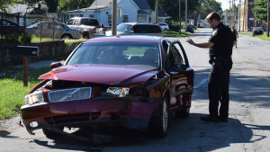 MPD Patrolman Chase Winkle at the scene of a hit and run accident on July 29th. Photo by: Mike Rhodes