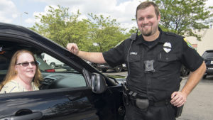 Pictured L-R: Betty Brewer, President and CEO of the Minnetrista Cultural Center and Chase Winkle, MPD patrolman prior to Betty's ride along on August 2nd. Photo by: Mike Rhodes