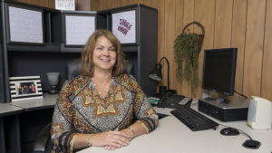 Sue Tschuor is pictured in her office at Woof Boom Radio, LLC. Photo by: Mike Rhodes