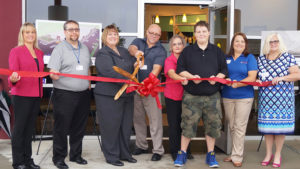 Pictured Left to Right: Brenda Lloyd, Hillcroft Services Board Chair; Michael Whitlock, Hillcroft Industries, VP Business Operations; Debbie Bennett, Hillcroft Services, CEO; Mike Salmon, Hillcroft Industries, VP Business Development; Melissa Johnson, Hillcroft Industries, Production Coordinator; Jacob Sloan, Hillcroft Industries Employee; Amanda Rammel, Hillcroft Industries, Manager;  LeAnne Cole, Hillcroft Services, VP. Photo by: Matt Howell, Farmhouse Creative.